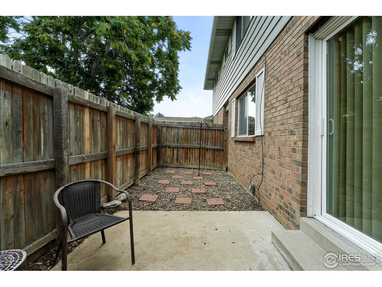 9857 Lane Street Thornton, CO 80260 - Photo 30 of 38 a backyard of a house