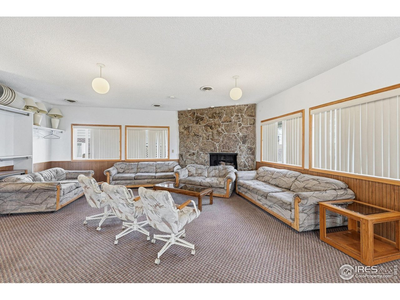 9857 Lane Street Thornton, CO 80260 - Photo 36 of 38 a living room with furniture and a fireplace