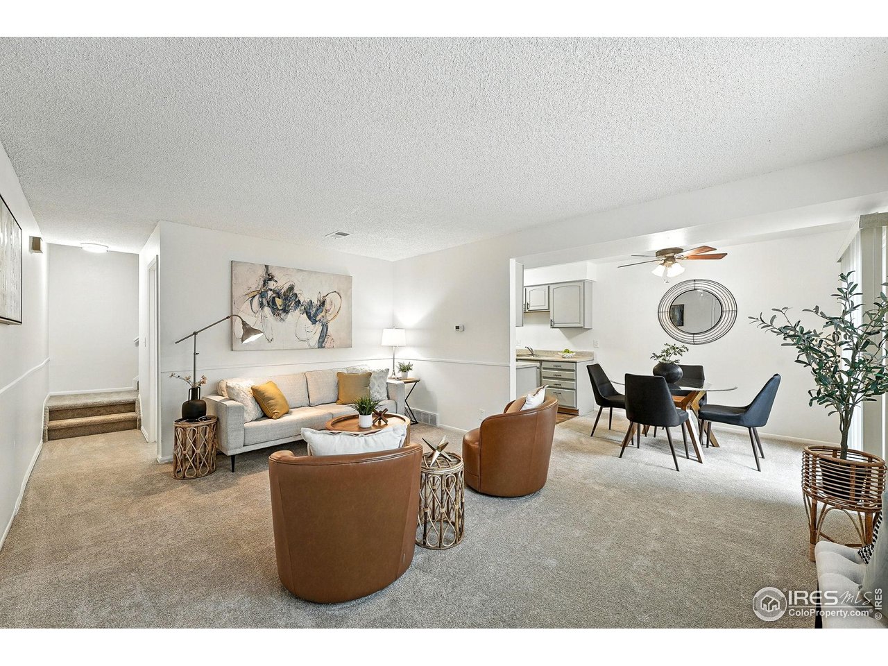 9857 Lane Street Thornton, CO 80260 - Photo 7 of 38 a living room with furniture and a large window