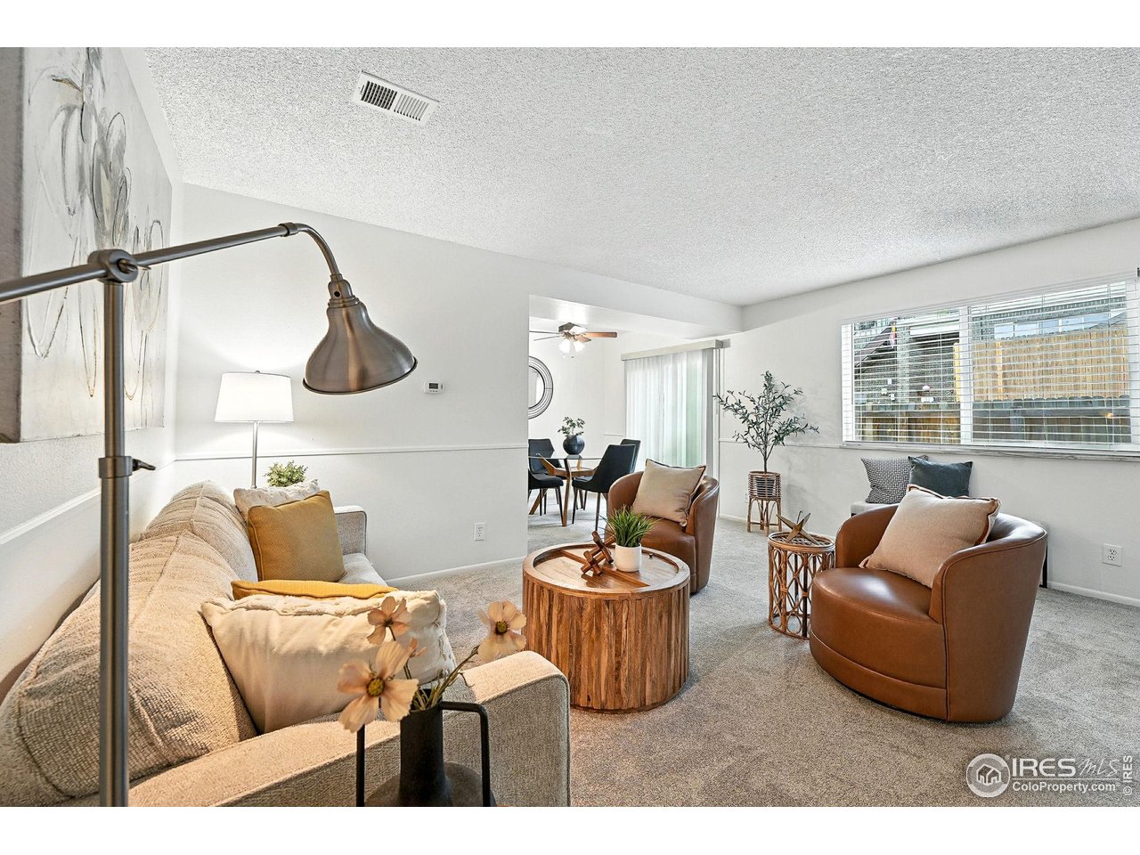 9857 Lane Street Thornton, CO 80260 - Photo 8 of 38 a living room with furniture and a window