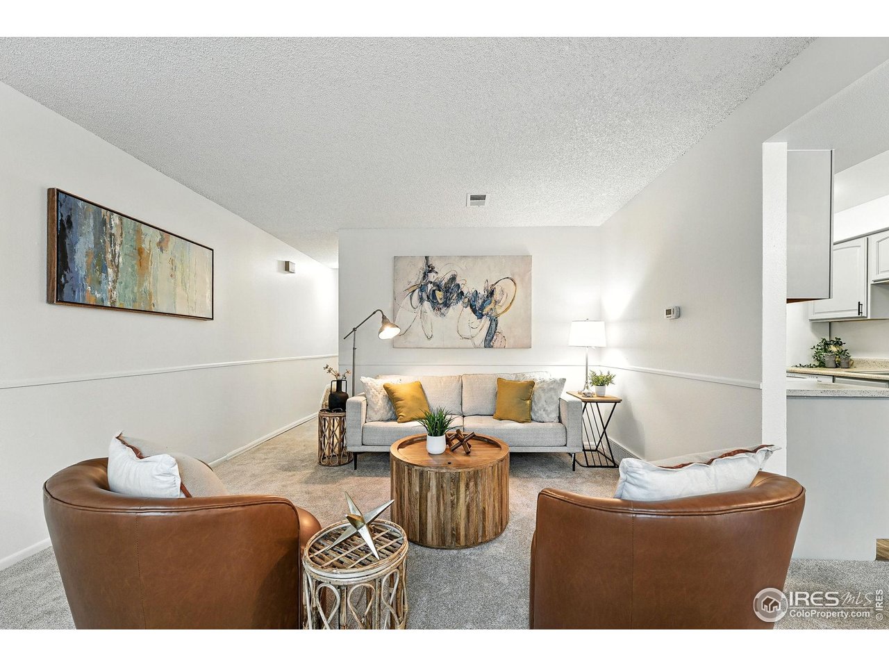 9857 Lane Street Thornton, CO 80260 - Photo 10 of 38 a living room with furniture and white walls