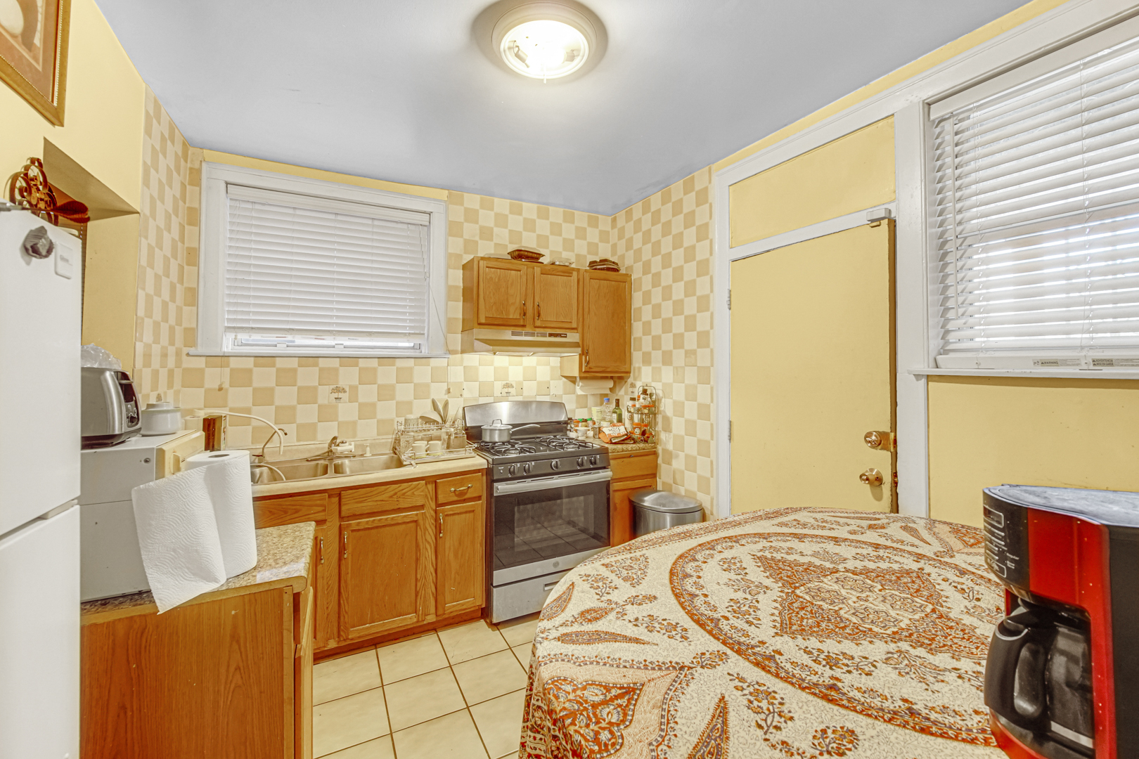 1758 East 72nd Street Chicago, IL 60649 - Photo 11 of 20 a bedroom with a sink and a bed