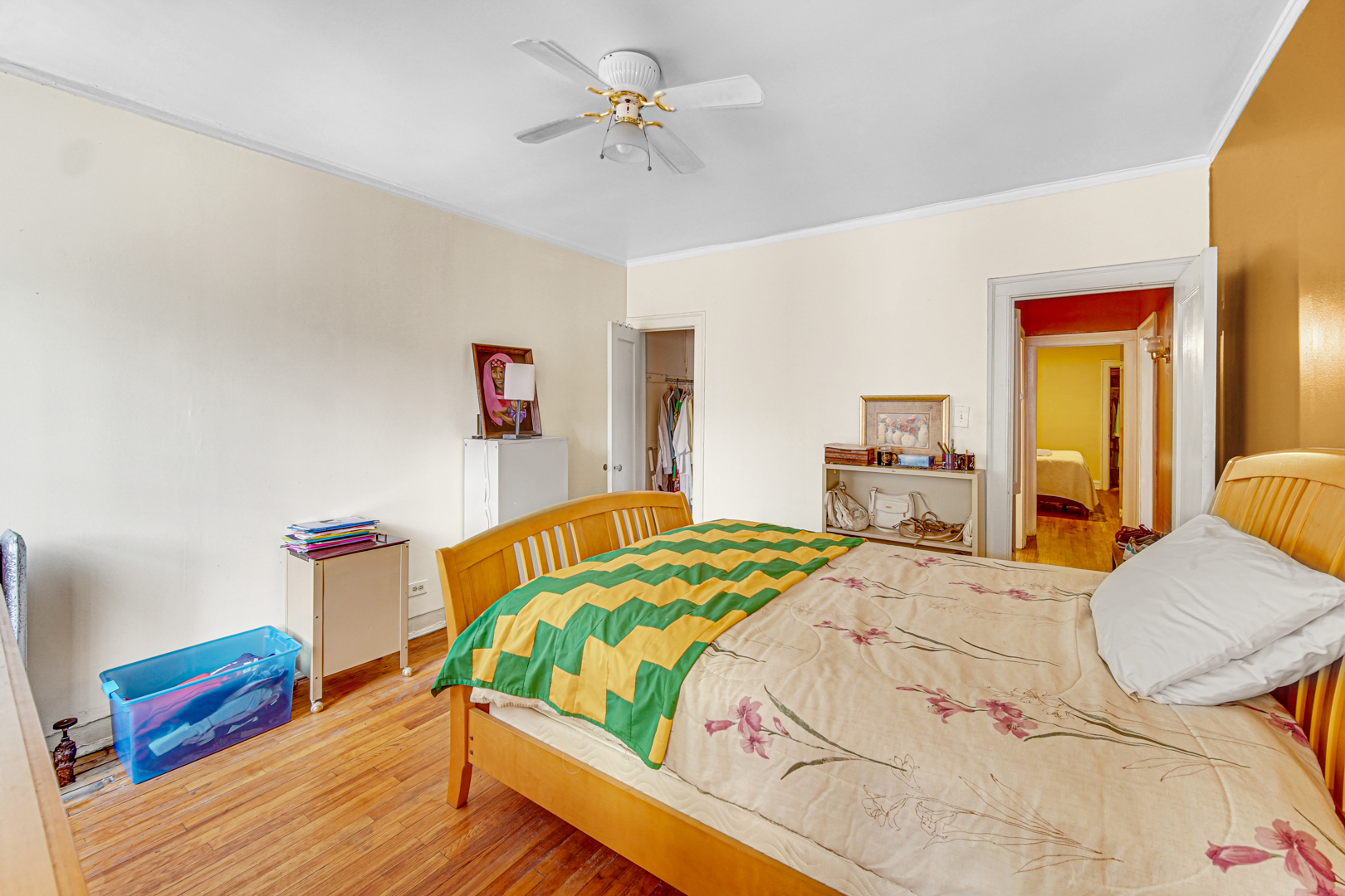1758 East 72nd Street Chicago, IL 60649 - Photo 13 of 20 a bedroom with a bed and wooden floor
