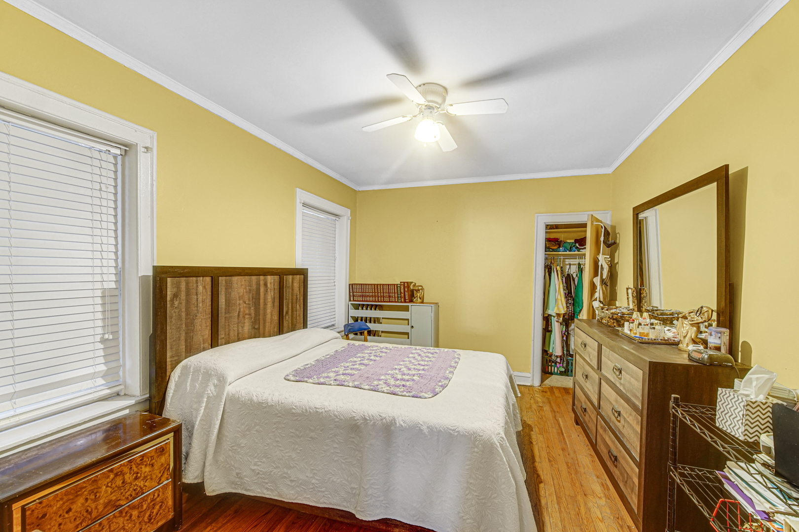 1758 East 72nd Street Chicago, IL 60649 - Photo 15 of 20 a bedroom with a bed and wooden floor