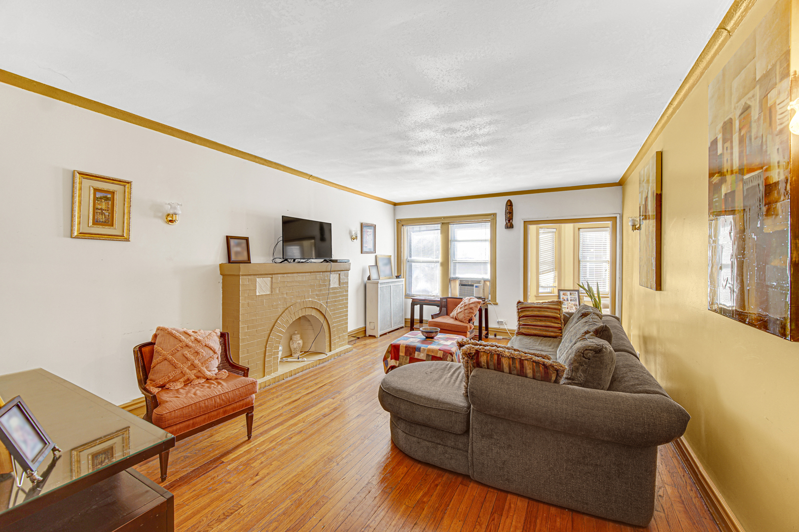 1758 East 72nd Street Chicago, IL 60649 - Photo 7 of 20 a living room with furniture and a fireplace