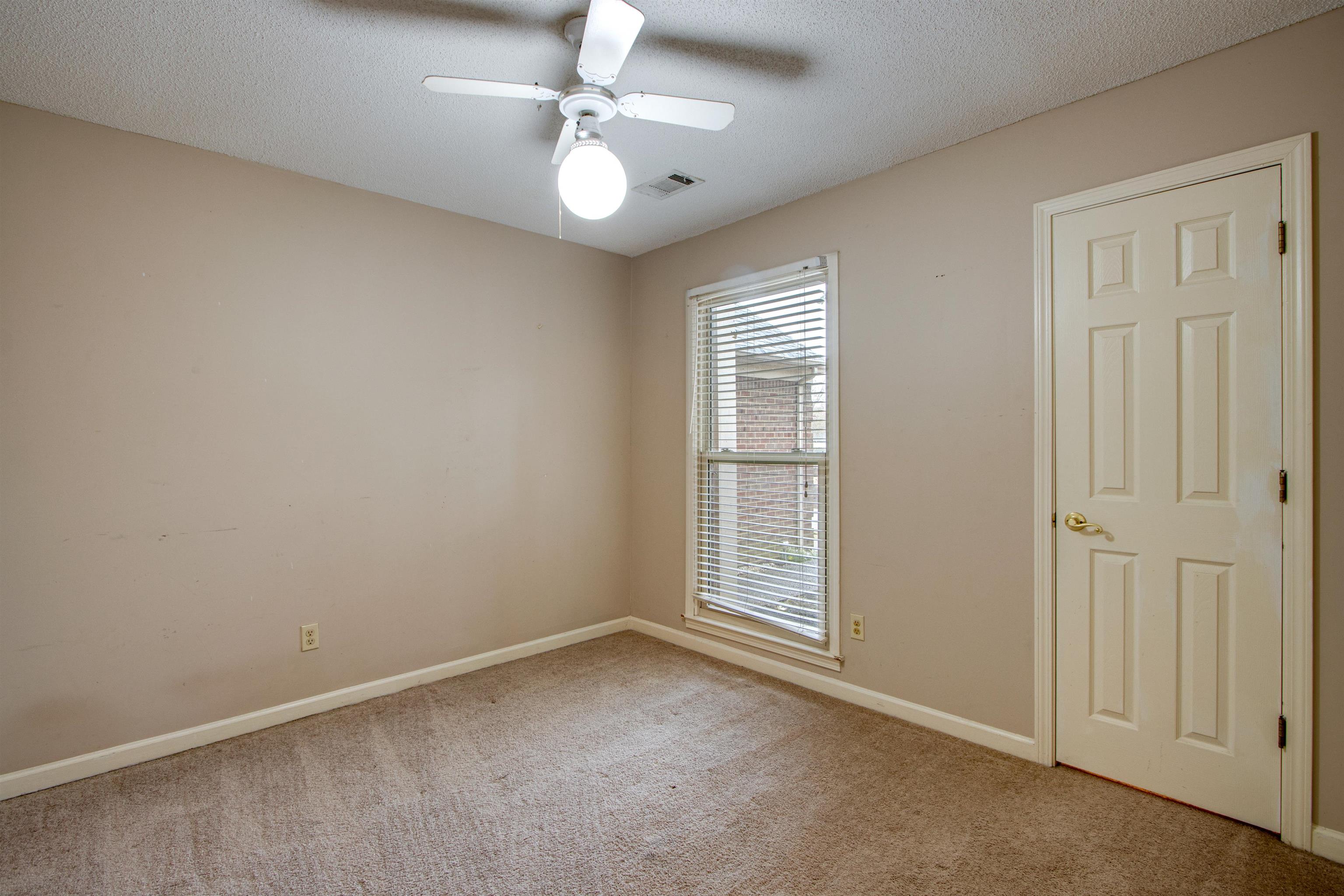 690 Ridge Fall Drive Memphis, TN 38018 - Photo 15 of 28 an empty room with chandelier fan