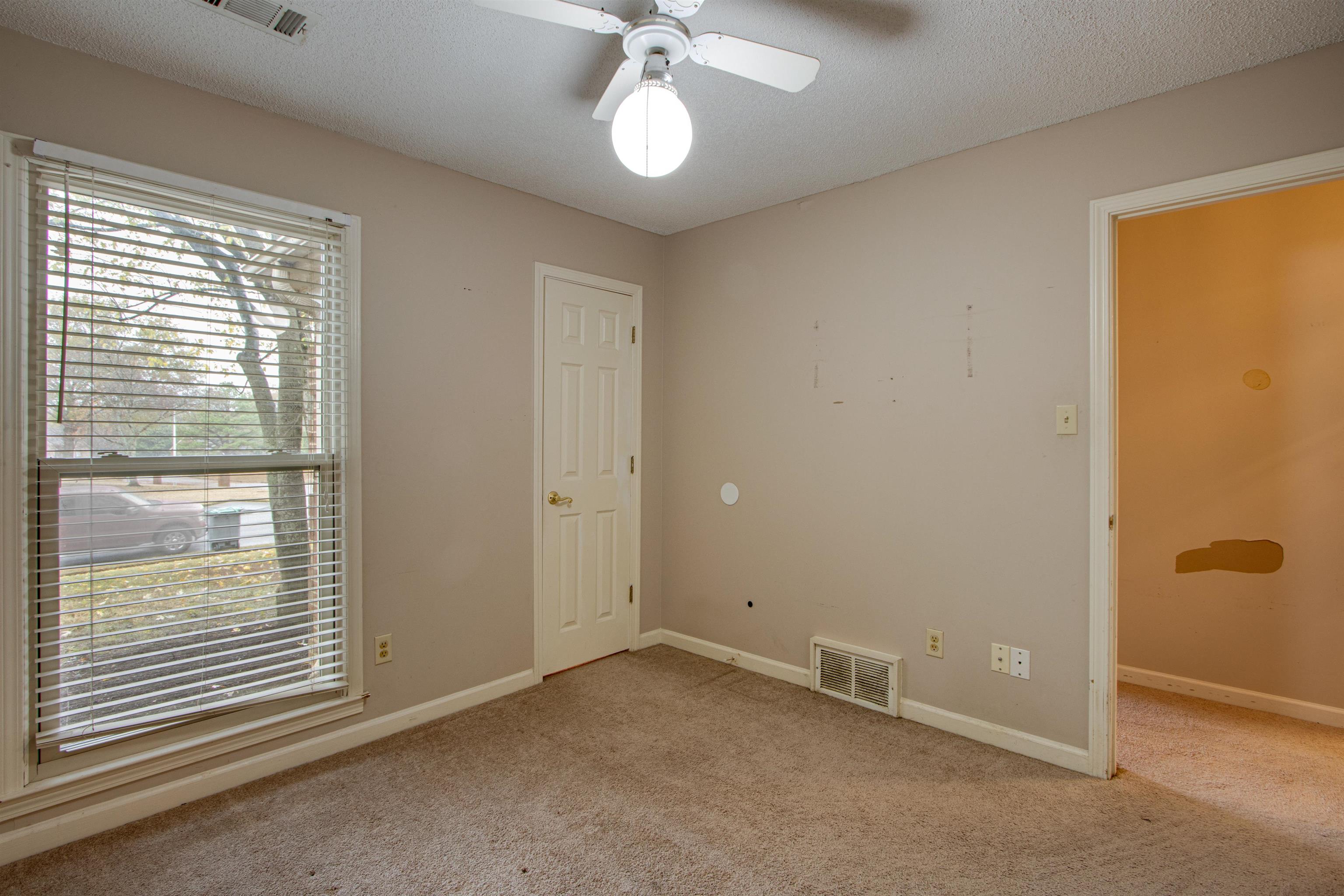 690 Ridge Fall Drive Memphis, TN 38018 - Photo 16 of 28 a view of an empty room with a window