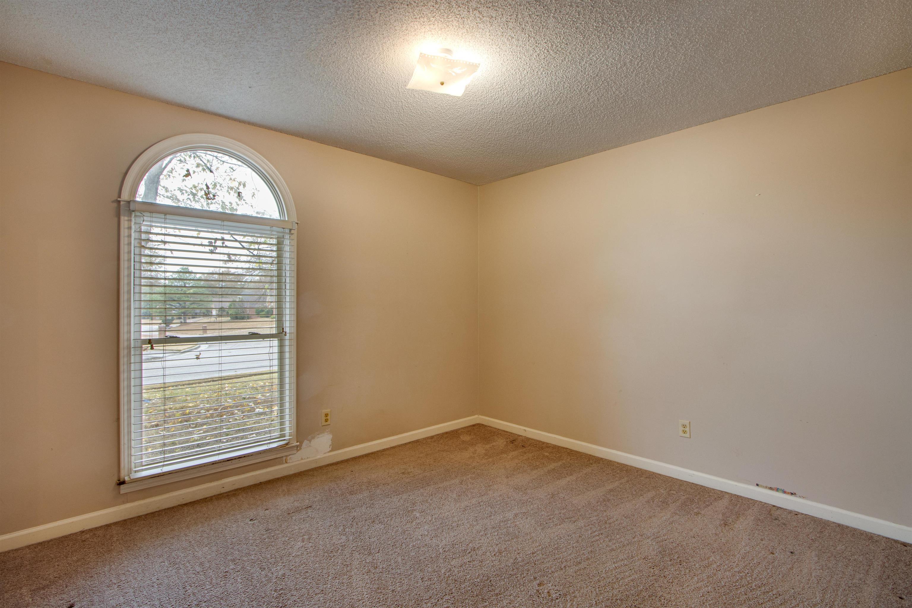 690 Ridge Fall Drive Memphis, TN 38018 - Photo 17 of 28 an empty room with windows