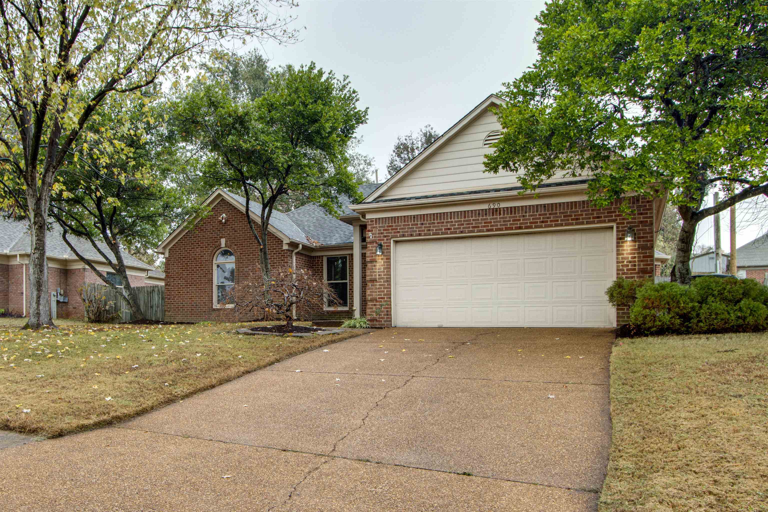 690 Ridge Fall Drive Memphis, TN 38018 - Photo 2 of 28 a house that has a tree in front of it