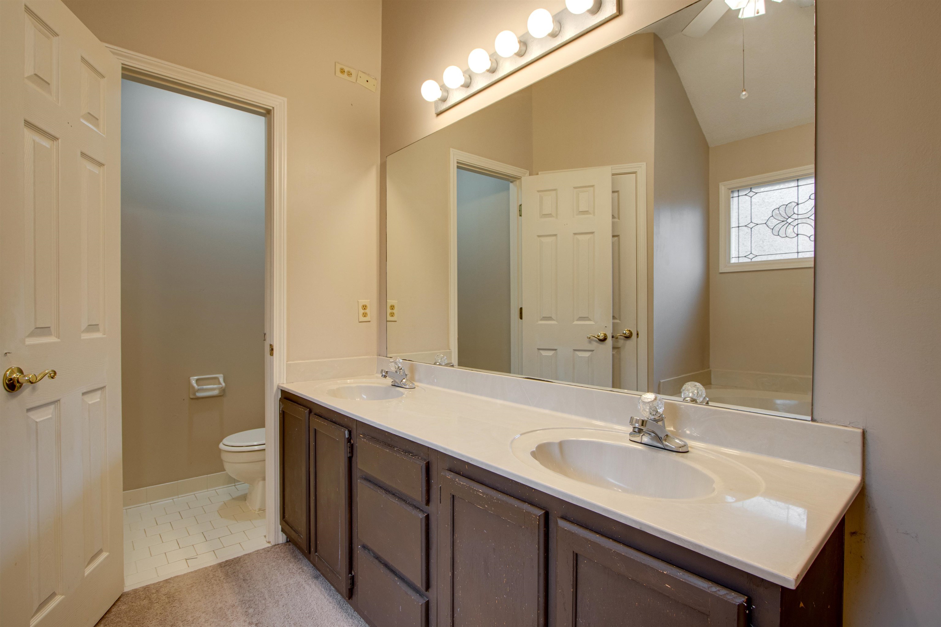 690 Ridge Fall Drive Memphis, TN 38018 - Photo 23 of 28 a bathroom with a sink double vanity and a mirror