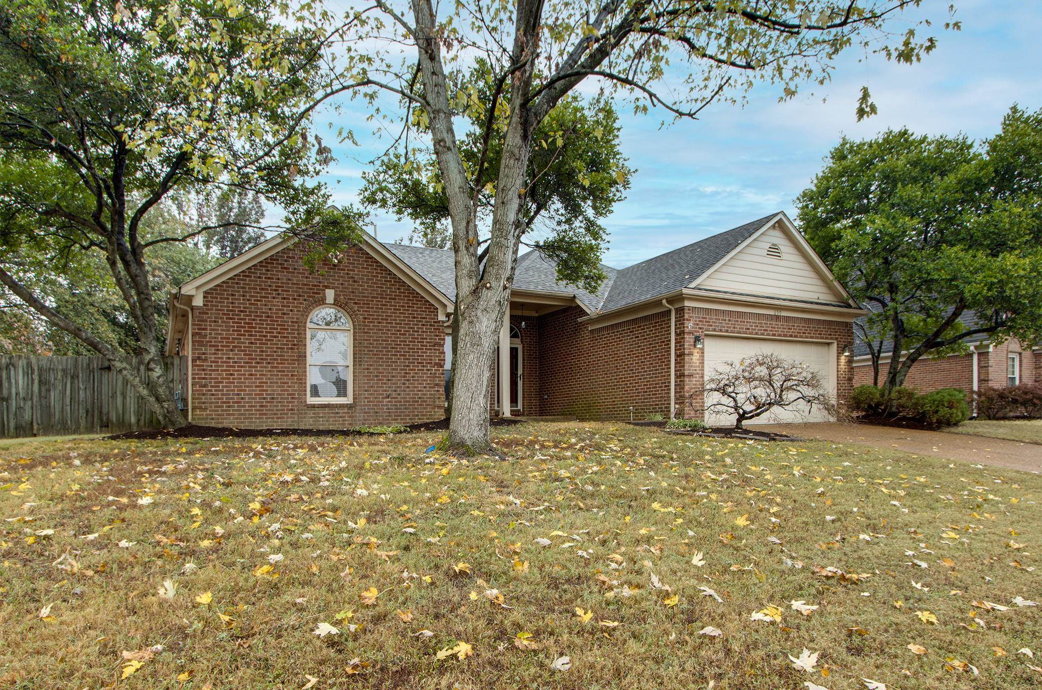 690 Ridge Fall Drive Memphis, TN 38018 - Photo 3 of 28 a house with a tree in front of it
