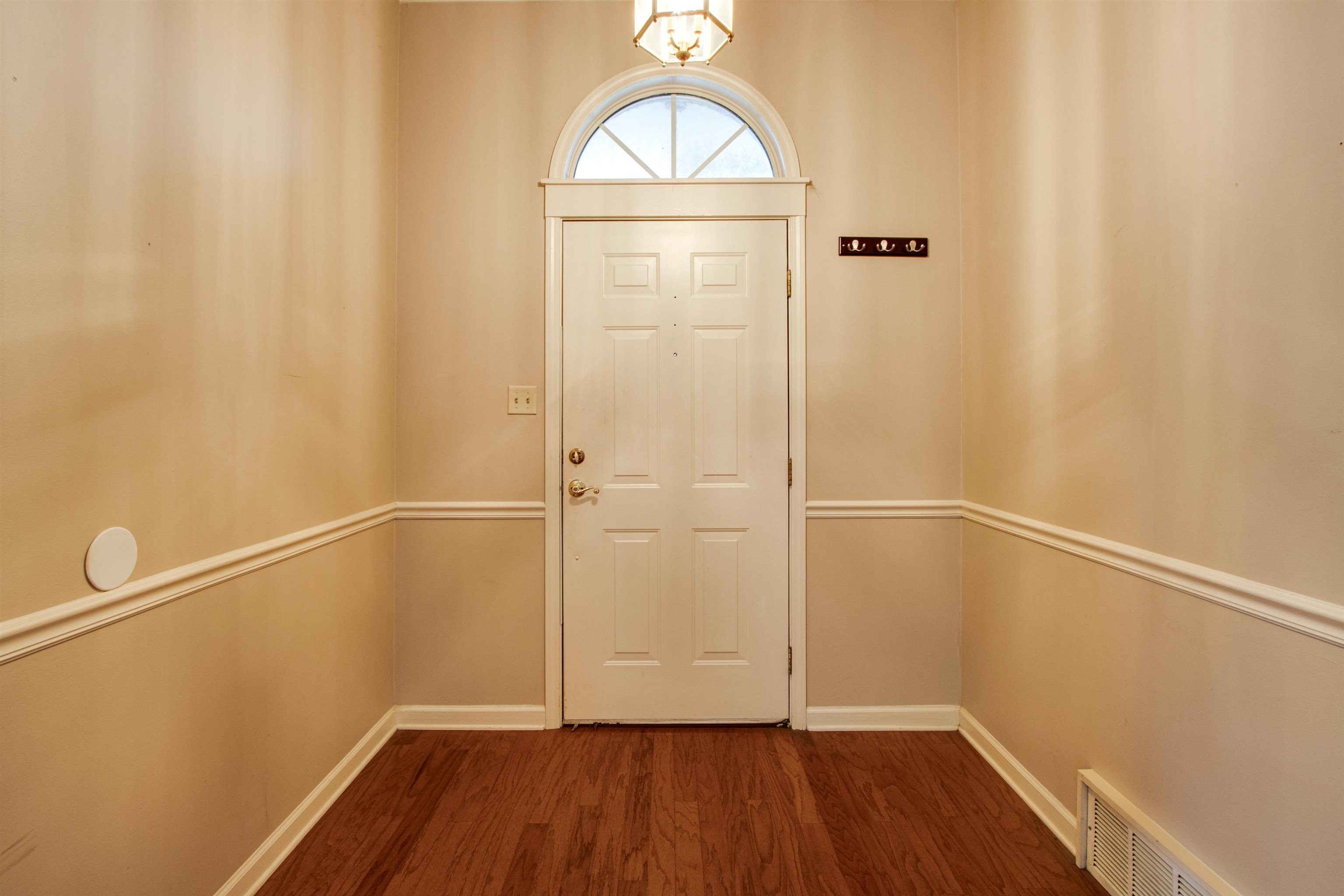 690 Ridge Fall Drive Memphis, TN 38018 - Photo 5 of 28 a view of small space with wooden floor and white walls