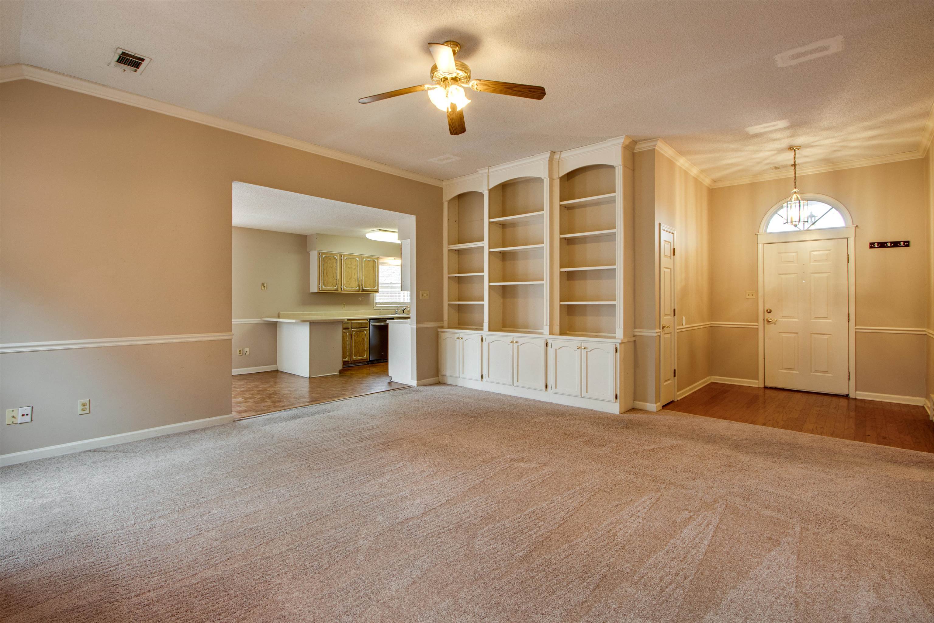690 Ridge Fall Drive Memphis, TN 38018 - Photo 8 of 28 a view of an empty room with a fireplace and a window