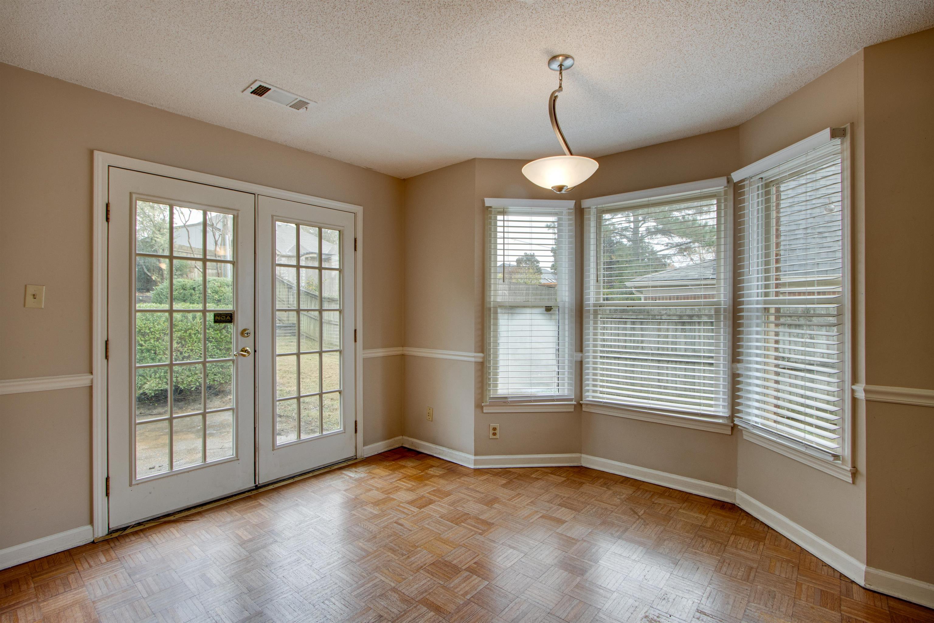 690 Ridge Fall Drive Memphis, TN 38018 - Photo 10 of 28 a view of an empty room with a window