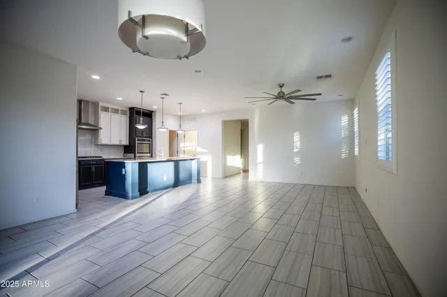 a view of a kitchen with a sink and cabinets