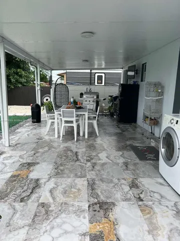 a view of a workspace with furniture