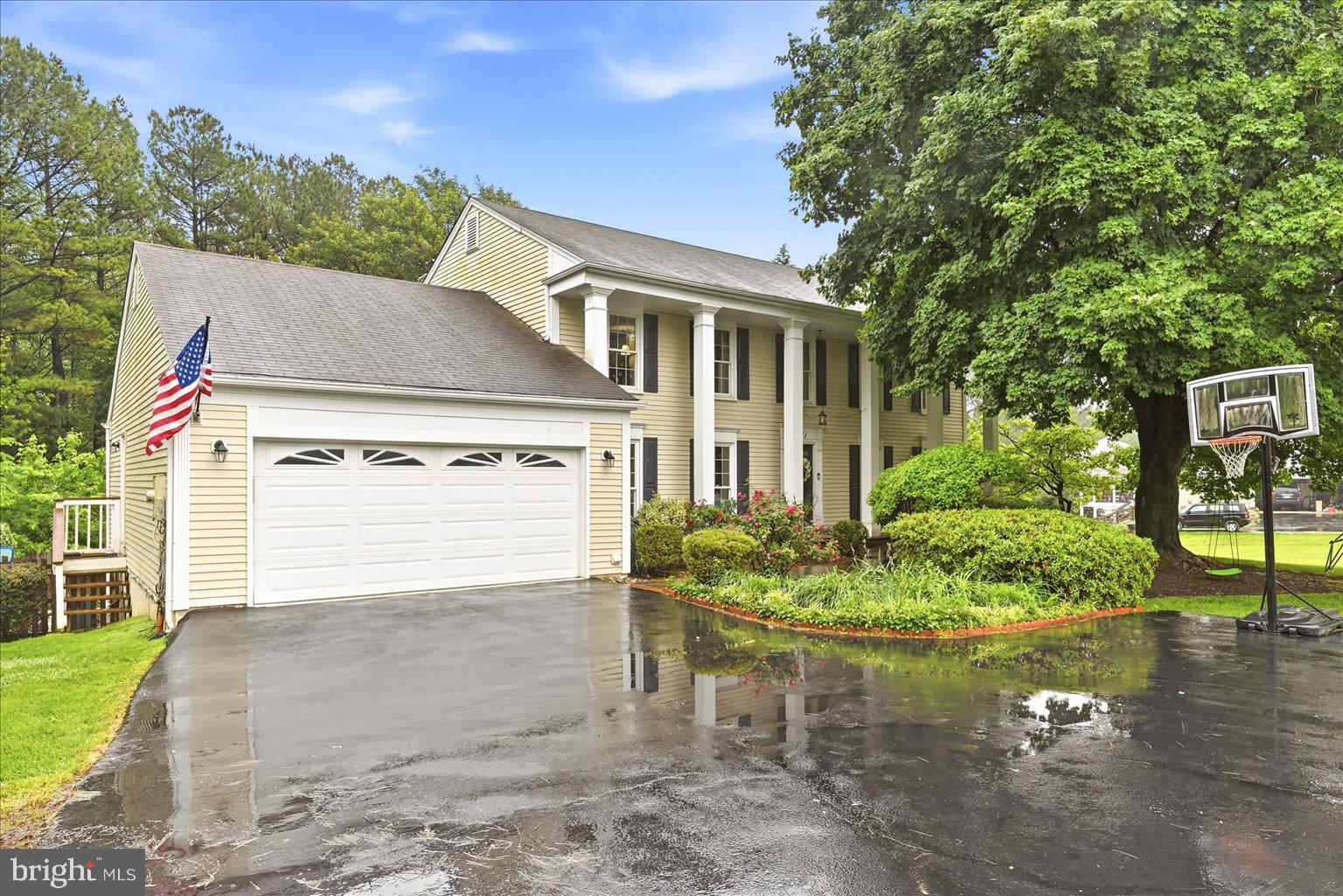 911 Riva Ridge Drive Great Falls, VA 22066 - Photo 2 of 55 Charming home with lush greenery.