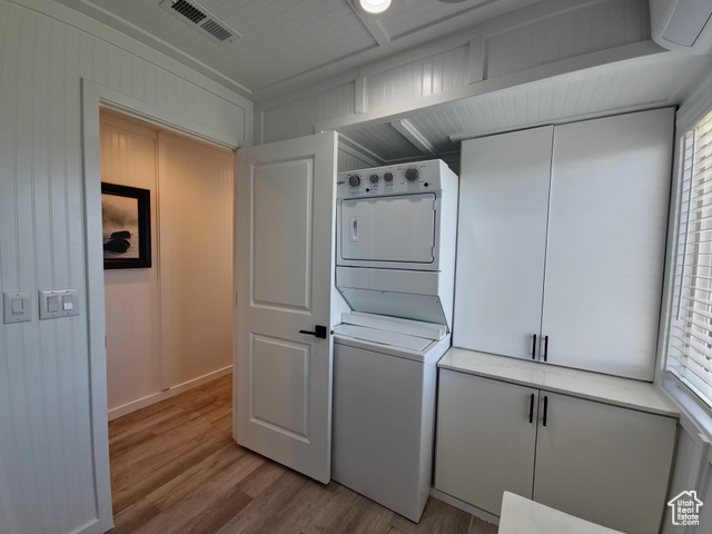 900 Altamont Road Evanston, WY 82930 - Photo 14 of 27 Washroom featuring stacked washing machine and dryer and light wood-style floors