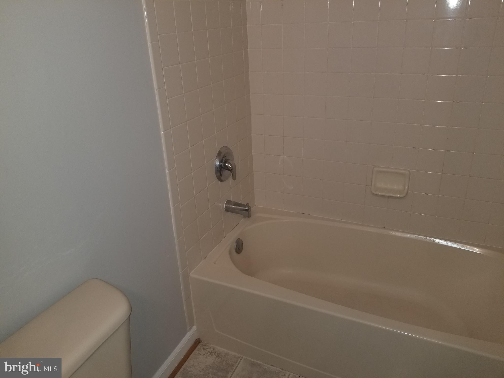 98 Thomas Harmon Drive Camden, DE 19934 - Photo 12 of 21 a white bath tub sitting next to a toilet