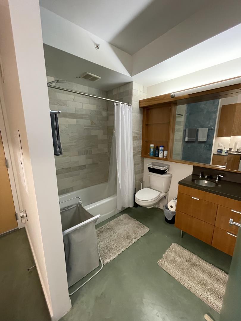 766 Harrison Street, Unit 202 San Francisco, CA 94107 - Photo 4 of 4 a room with a couch and a table