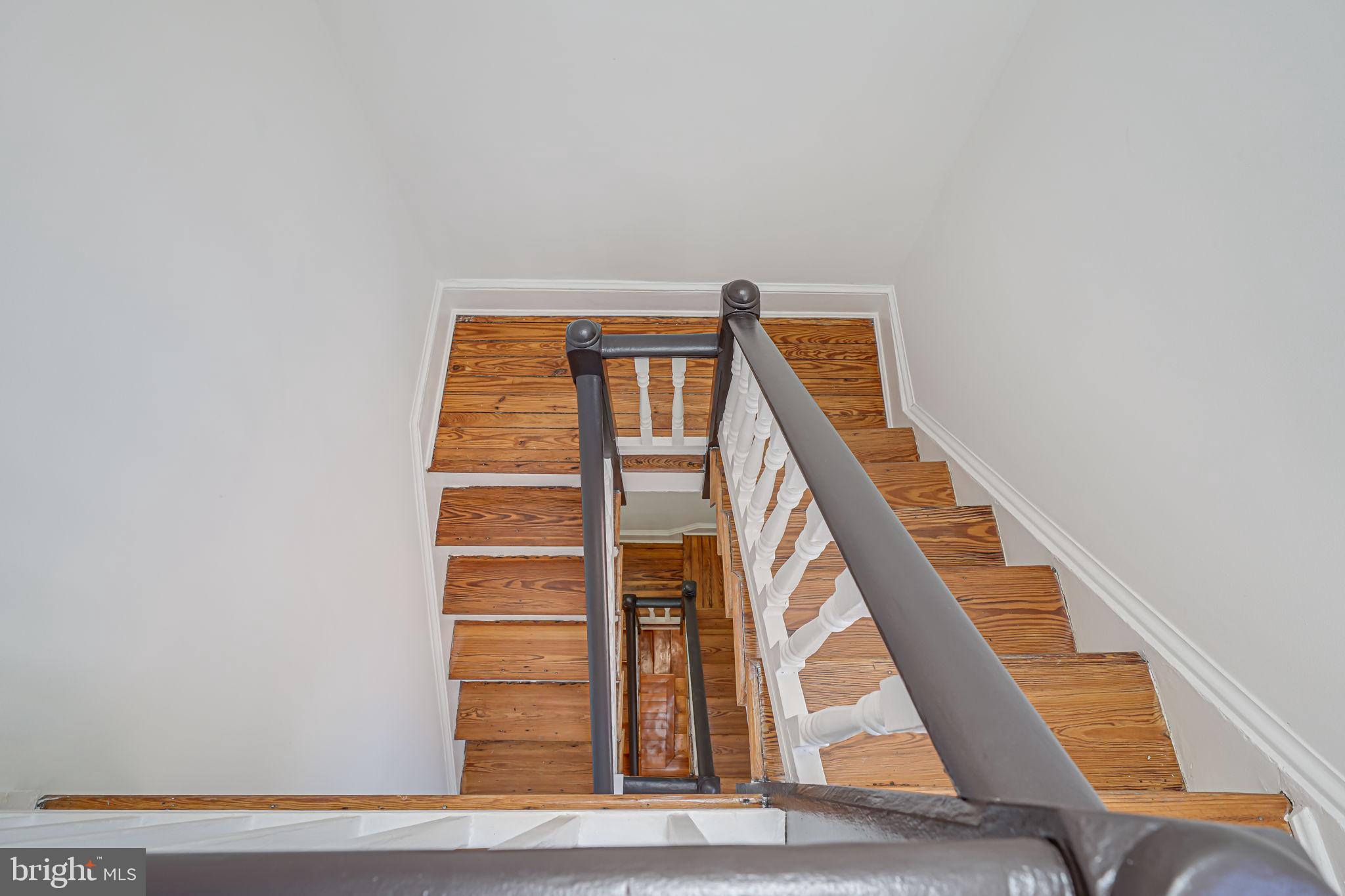106 3rd Street Northeast Washington, DC 20002 - Photo 31 of 63 a view of staircase with white walls and a window