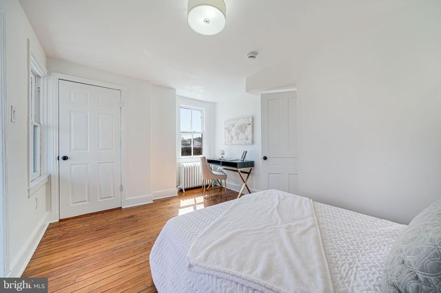 a balcony with furniture and wooden floor