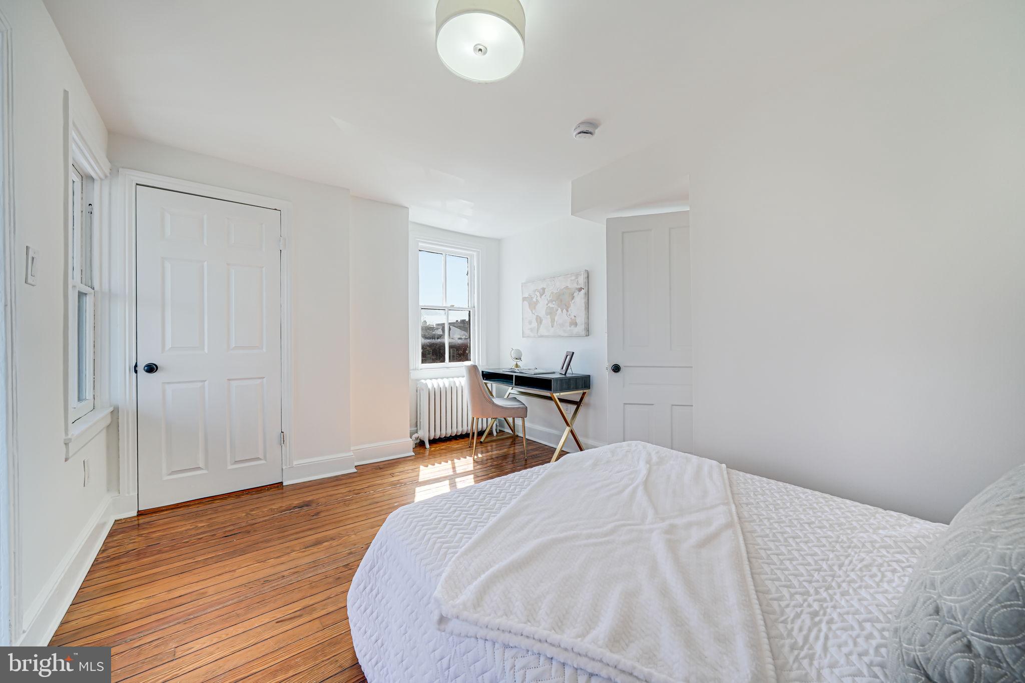 106 3rd Street Northeast Washington, DC 20002 - Photo 37 of 63 a bed room with a bed and cabinets