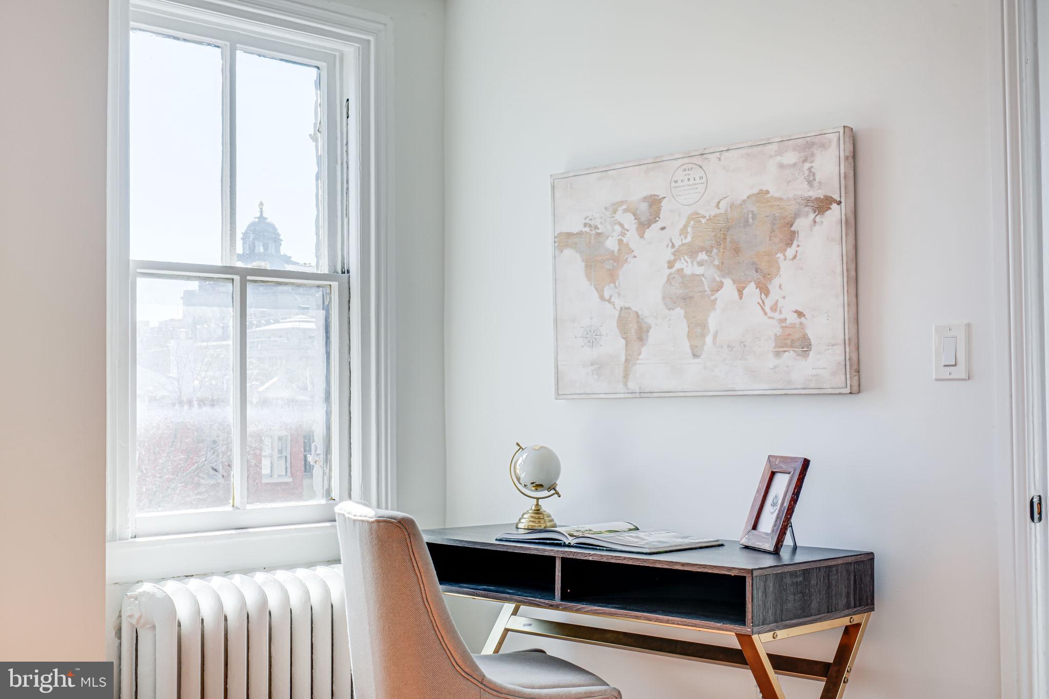 106 3rd Street Northeast Washington, DC 20002 - Photo 38 of 63 a view of a workspace with furniture and a window