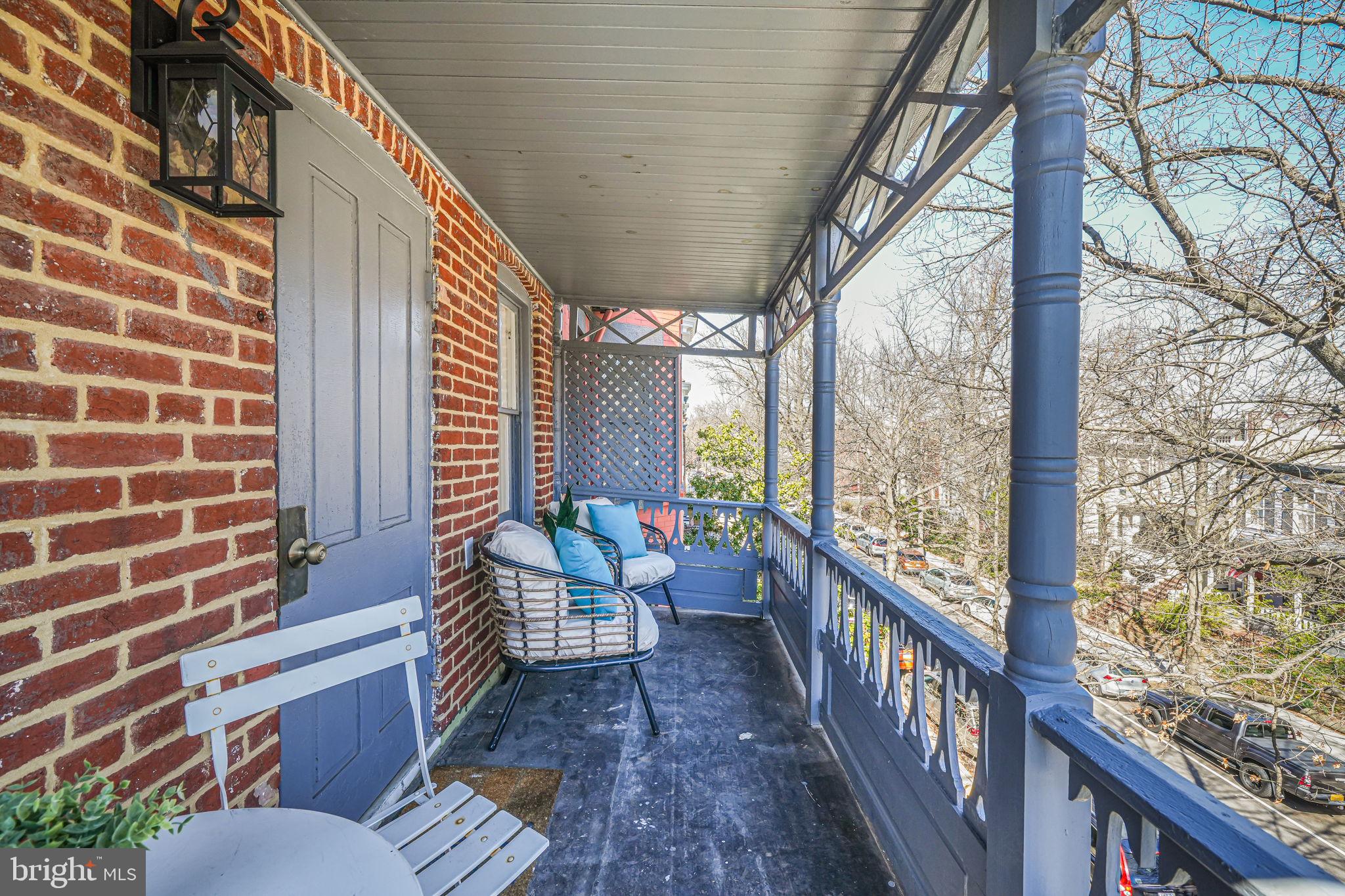 106 3rd Street Northeast Washington, DC 20002 - Photo 43 of 63 a balcony with chairs and wooden fence