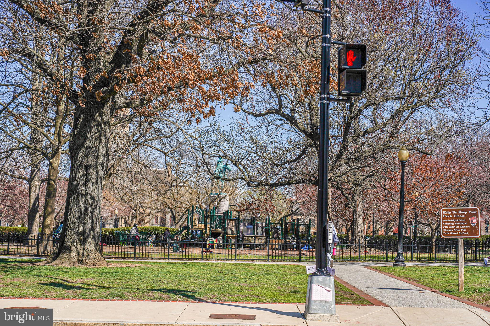 106 3rd Street Northeast Washington, DC 20002 - Photo 55 of 63 a street sign on a sidewalk next to a road