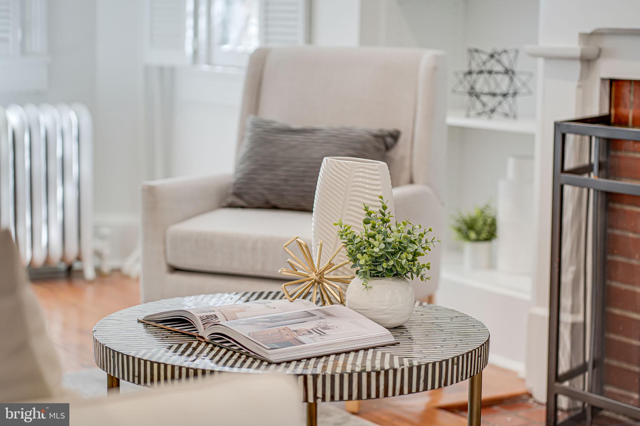 106 3rd Street Northeast Washington, DC 20002 - Photo 10 of 63 a living room with furniture and a window