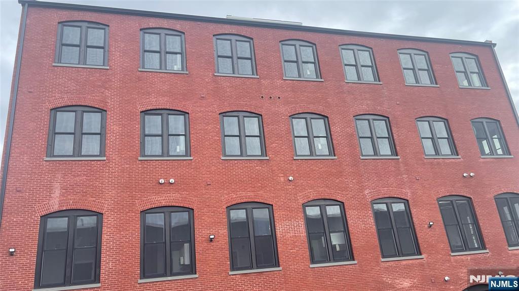 a front view of a building with large windows