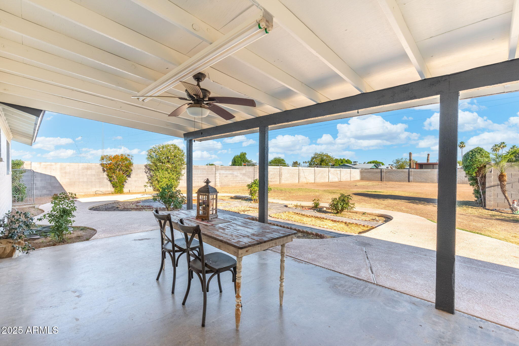 2261 East Decatur Street Mesa, AZ 85213 - Photo 33 of 47 a dining room with furniture and a floor to ceiling window