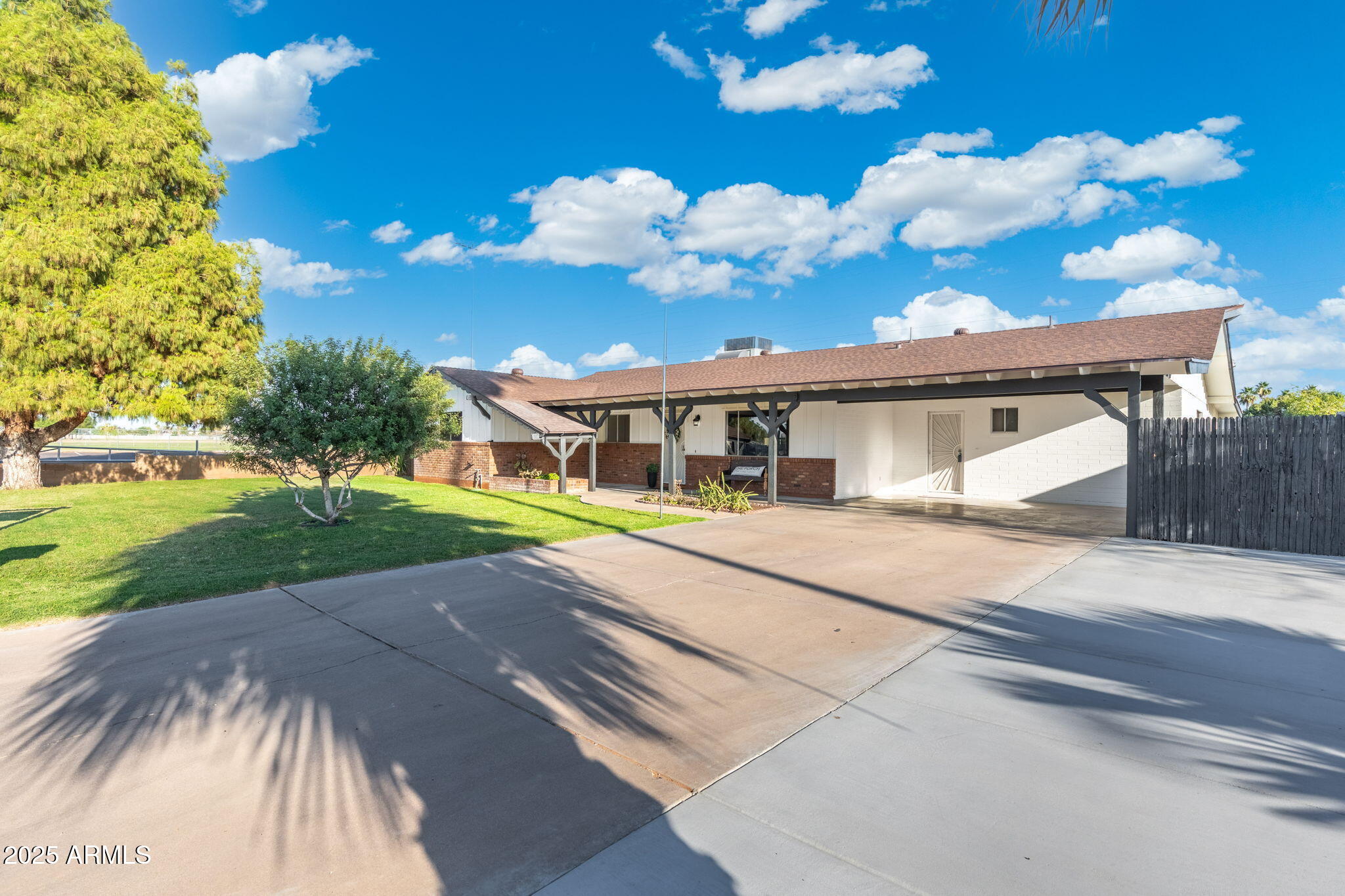 2261 East Decatur Street Mesa, AZ 85213 - Photo 3 of 47 a view of a house with a yard