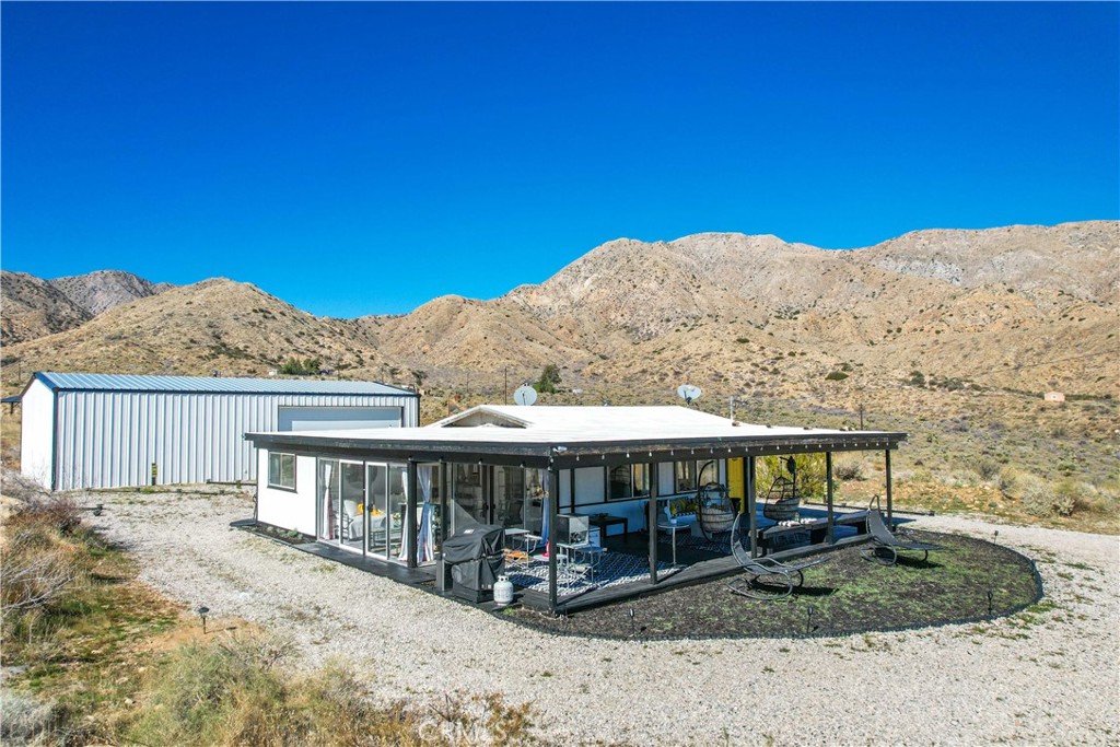 49490 Big Morongo Canyon Road Morongo Valley, CA 92256 - Photo 3 of 75 a view of a house with a yard from a balcony