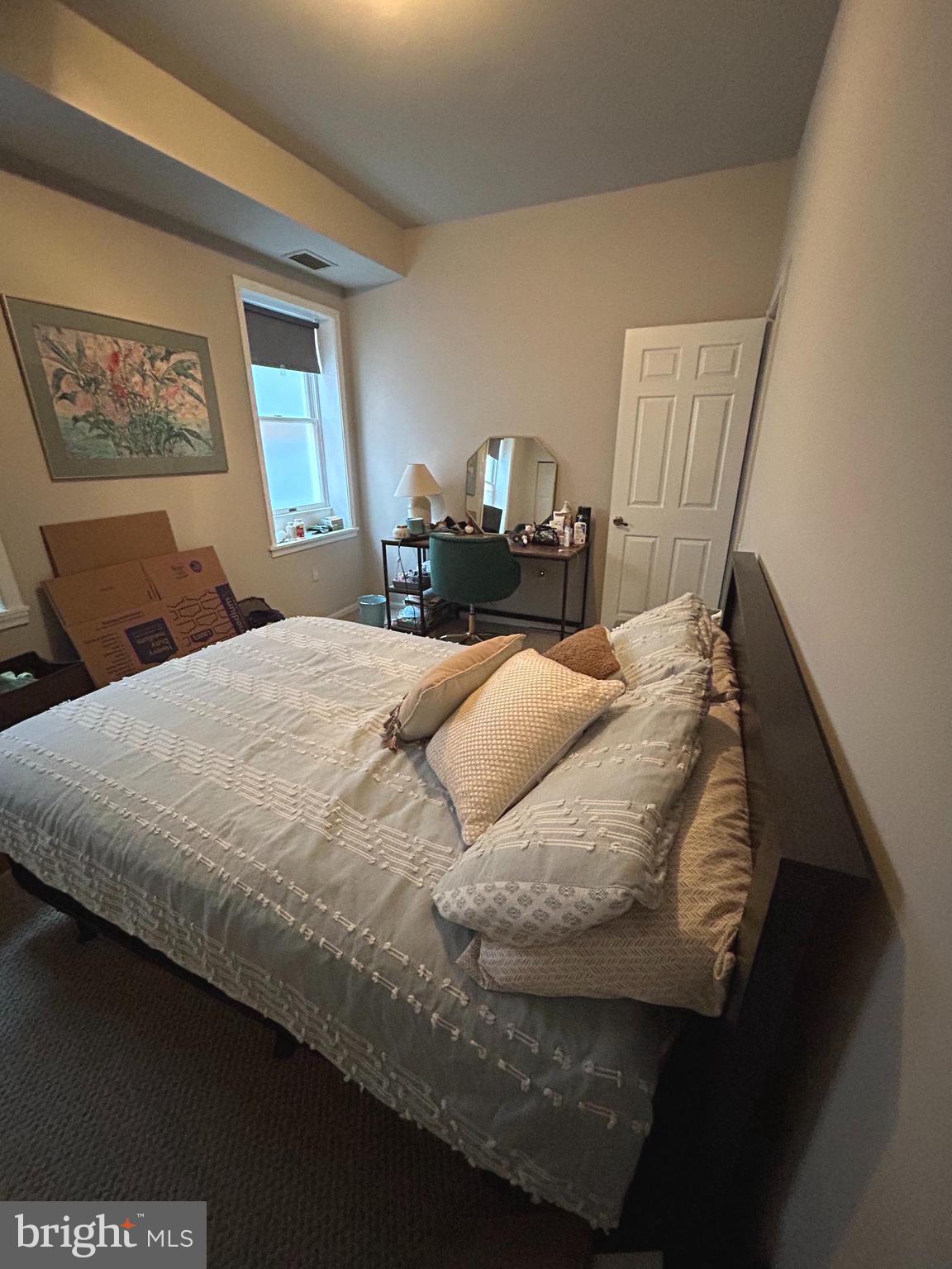 937 Spruce Street Philadelphia, PA 19107 - Photo 40 of 80 a bed sitting in a bedroom next to a window