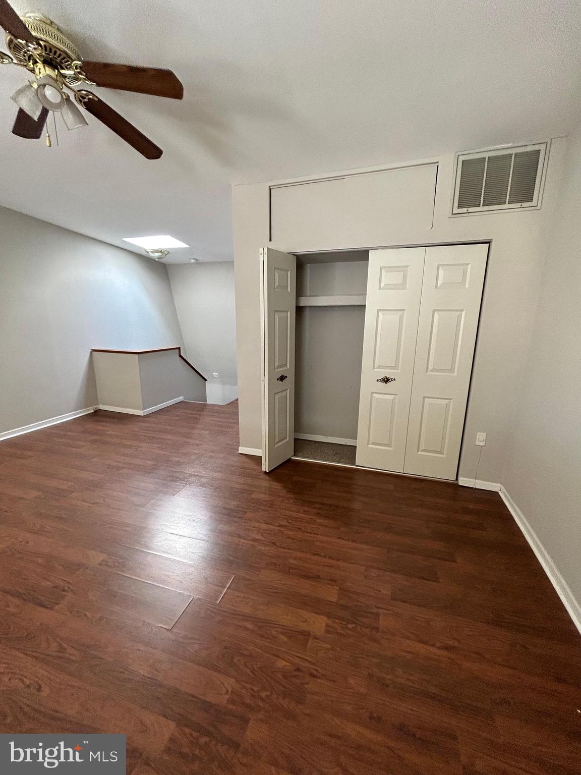 937 Spruce Street Philadelphia, PA 19107 - Photo 62 of 80 an empty room with wooden floor cabinet and windows