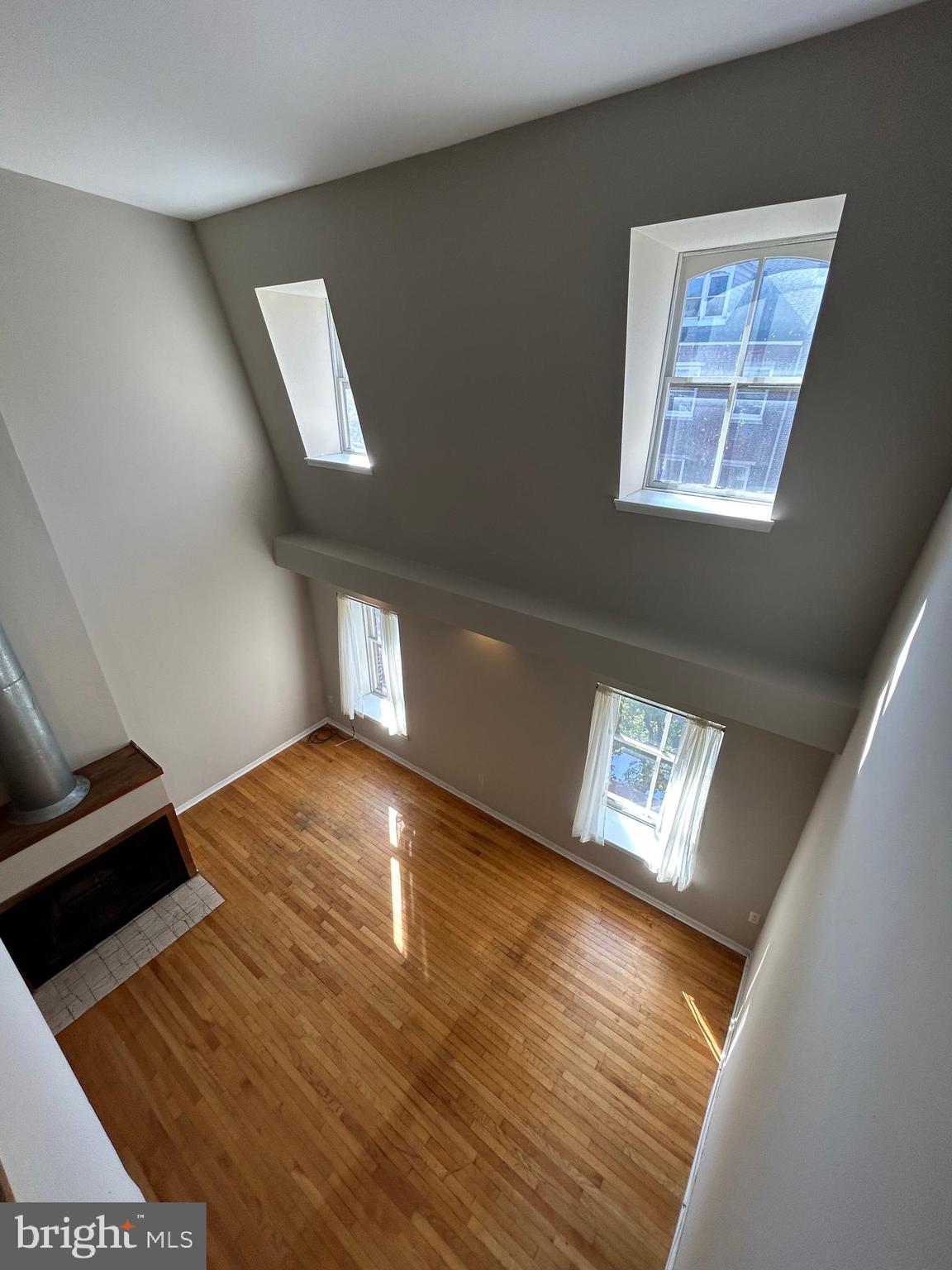 937 Spruce Street Philadelphia, PA 19107 - Photo 64 of 80 a view of an empty room and window and wooden floor