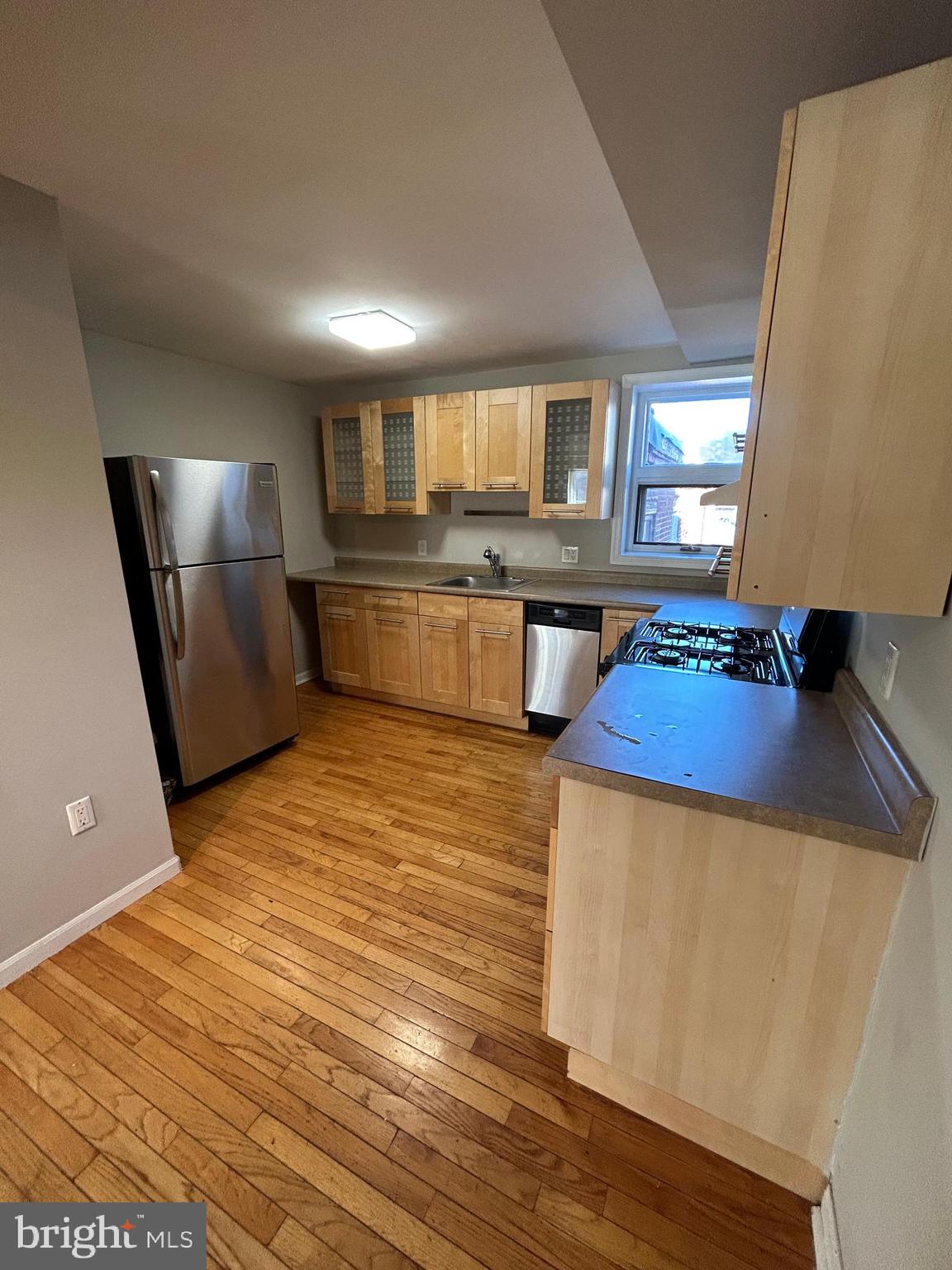 937 Spruce Street Philadelphia, PA 19107 - Photo 69 of 80 a kitchen with stainless steel appliances granite countertop a sink a stove top oven a counter space and cabinets