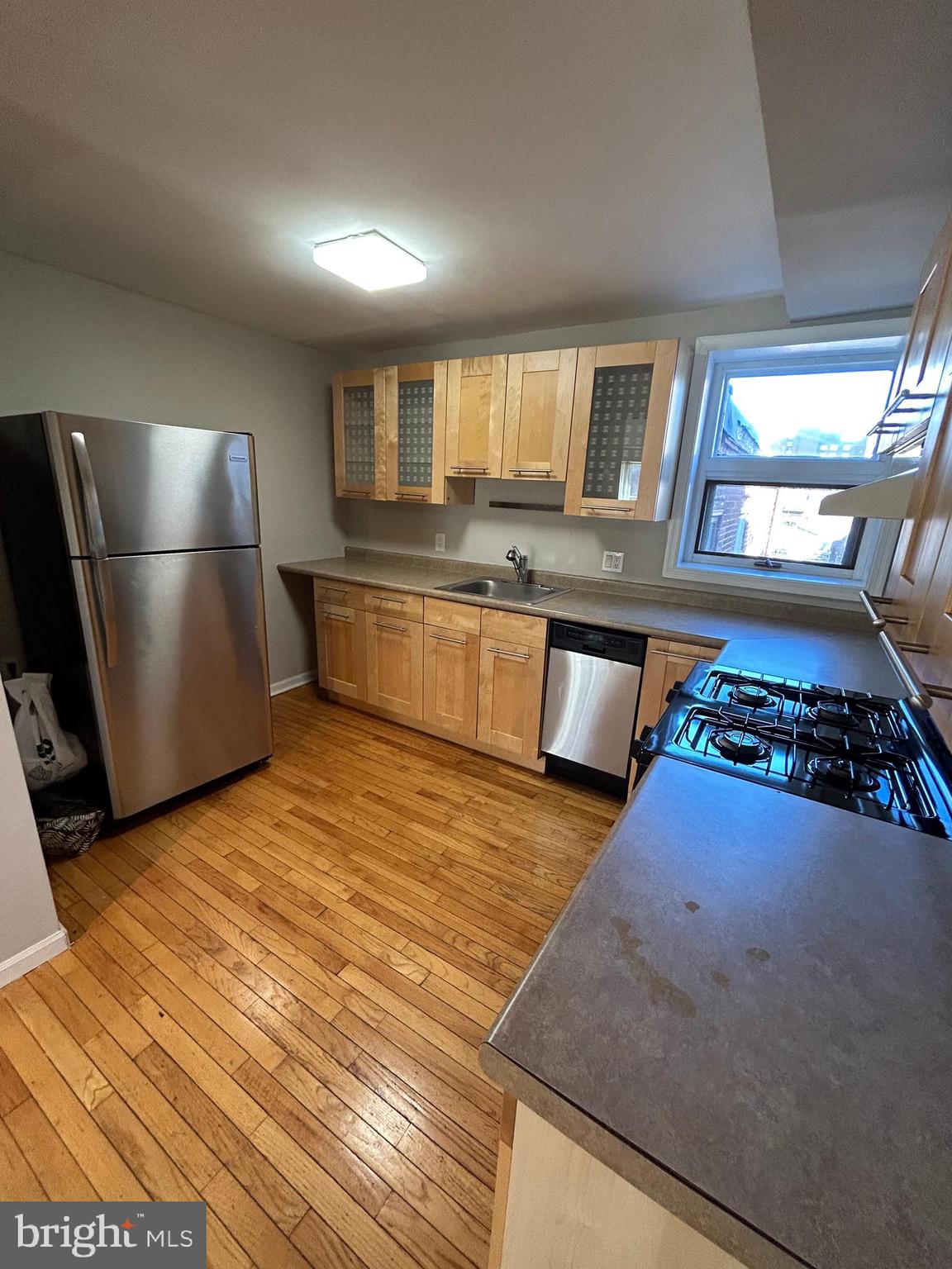 937 Spruce Street Philadelphia, PA 19107 - Photo 70 of 80 a kitchen with stainless steel appliances granite countertop a refrigerator and a stove