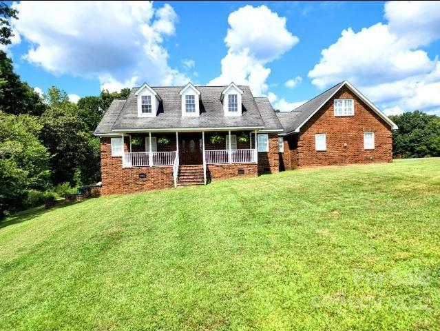 1405 Biggers Cemetery Road Monroe, NC 28110 - Photo 1 of 29 a view of a house with a yard and sitting area