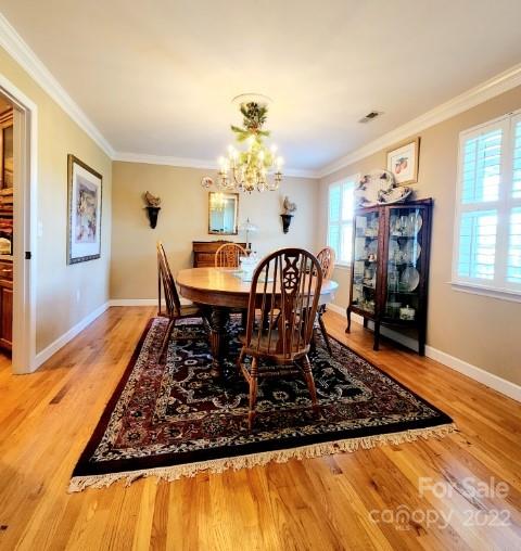1405 Biggers Cemetery Road Monroe, NC 28110 - Photo 11 of 29 a view of a dining room with furniture window and wooden floor