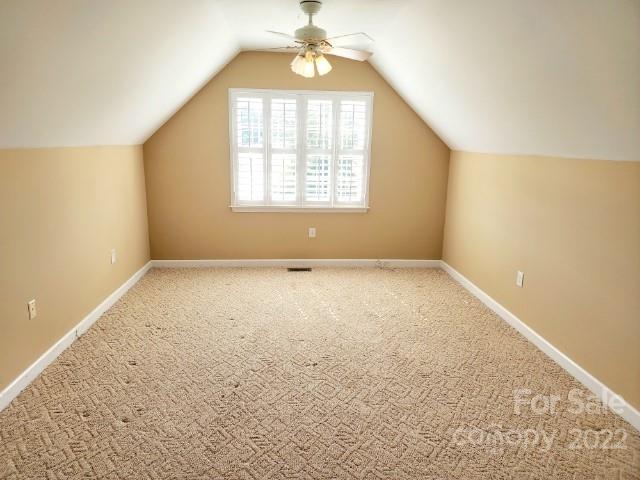1405 Biggers Cemetery Road Monroe, NC 28110 - Photo 18 of 29 an empty room with windows and chandelier fan
