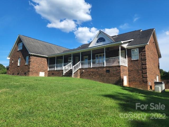 1405 Biggers Cemetery Road Monroe, NC 28110 - Photo 23 of 29 a front view of a house with a garden