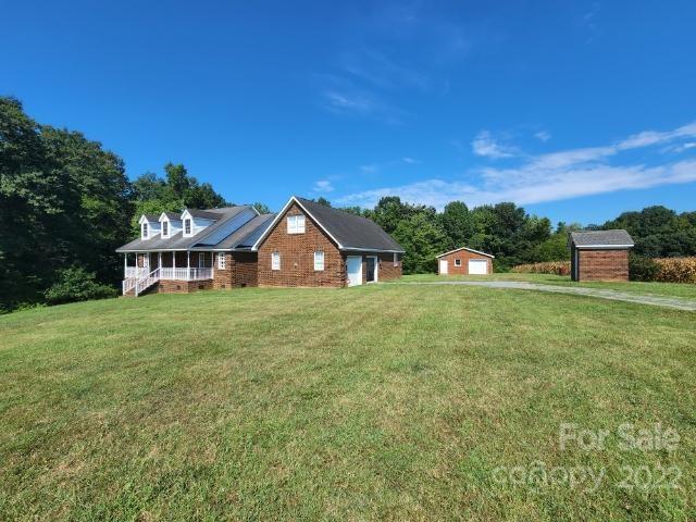 1405 Biggers Cemetery Road Monroe, NC 28110 - Photo 24 of 29 a front view of a house with a yard