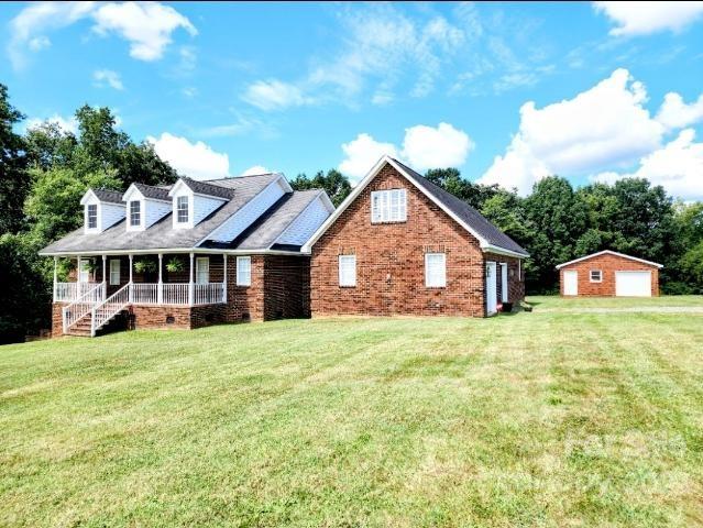 1405 Biggers Cemetery Road Monroe, NC 28110 - Photo 29 of 29 a front view of a house with garden