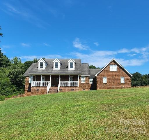 1405 Biggers Cemetery Road Monroe, NC 28110 - Photo 4 of 29 a view of a house with a big yard and large trees