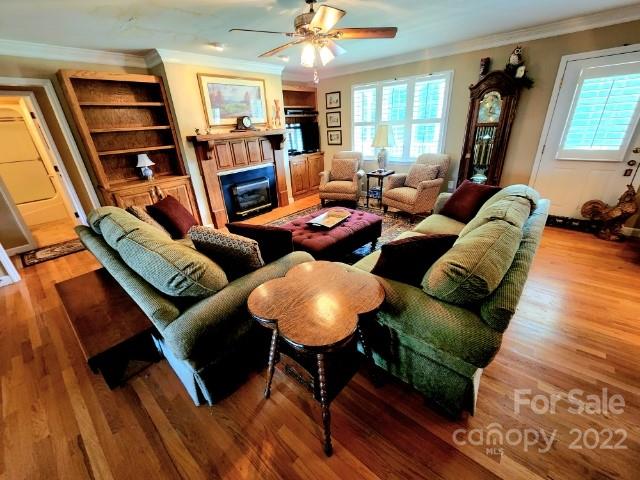 1405 Biggers Cemetery Road Monroe, NC 28110 - Photo 6 of 29 a living room with furniture and a wooden floor