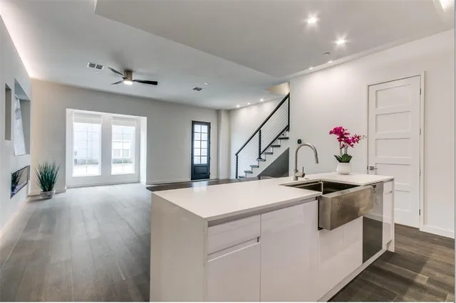 a kitchen with stainless steel appliances a stove and a microwave