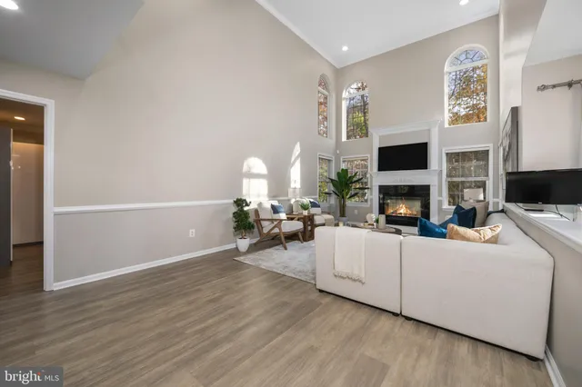 a view of staircase with lots of wooden floor and a window